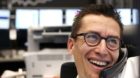 A trader makes a phone call at the stock market in Frankfurt, Germany, Friday, Nov.11, 2011, when the German stock index DAX