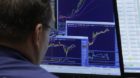 A specialist works on the floor of the New York Stock Exchange Friday, Nov. 11, 2011. Stocks surged Friday, erasing their los