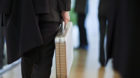 A man walks through the Fonds10, a financial fair, with a briefcase in his hands, pictured on February 3, 2010 at the Kongres