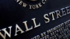 In this Jan. 4, 2010 photo, an historic marker is shown on Wall Street, in New York. Stocks traded in a tight range on Friday