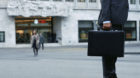 A business man stands in front of the UBS bank on Paradeplatz place in Zurich, Switzerland, pictured on October 13, 2008. (KE