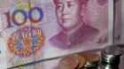 epa02725580 A view of Chinese 100 yuan or Renminbi (RMB) notes and coins in Beijing China on 10 May 2011. China's currency co