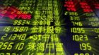 epa03758925 An electronic board showing the stock prices at a trading hall of a securities firm in Qingdao city, eastern Chin