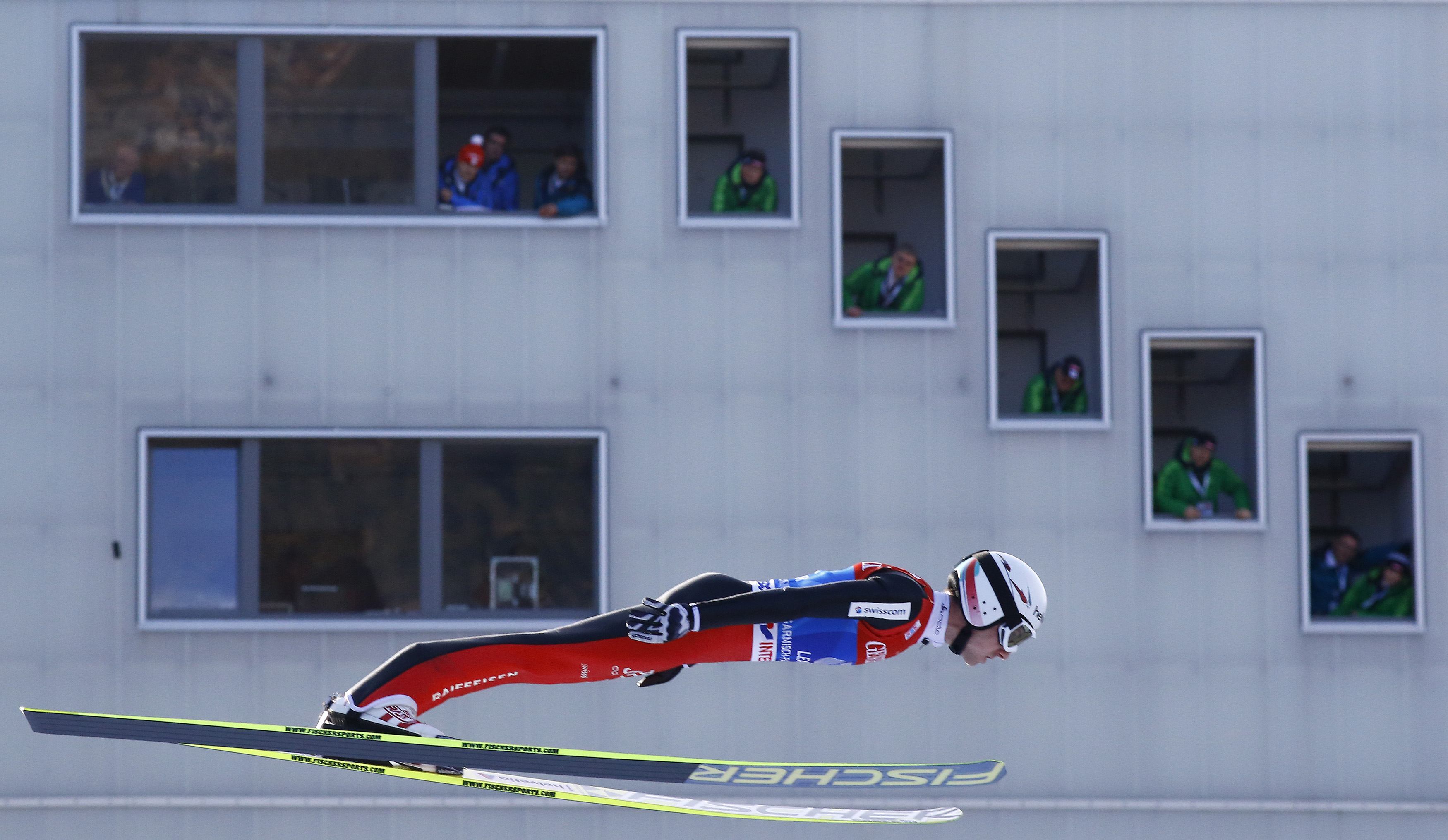 Switzerland's tournament overall leader Simon Ammann soars through the air to take the third place in the second jumping of the four-hills tournament in Garmisch-Partenkirchen, southern Germany, January 1, 2014. Austria's Thomas Diethart won ahead of his 