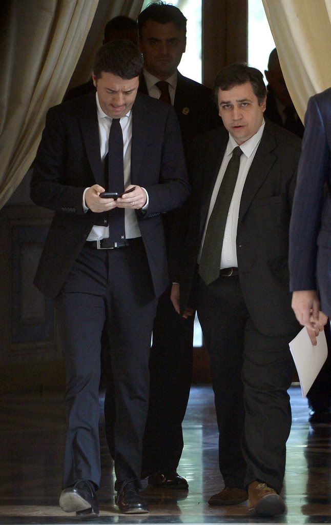 epa04083049 Italian designate premier Matteo Renzi (L) and his spokesman Filippo Sensi (R) leave Quirinale Palace after he received the role by Italian president Giorgio Napolitano to establish the new Italian Government in Rome, Italy, 17 February 2014. 