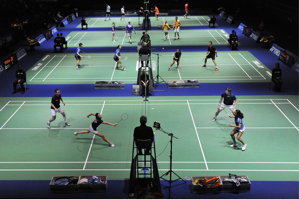 Switzerland's Christian Boesiger and Sanya Herzig return a shuttlecock to Germany's Tobias Wadenka and France's Teshana Vignes Waran, front from left, during their mixed doubles qualification match at the Badminton Swiss Open tournament in the St. Jakobsh