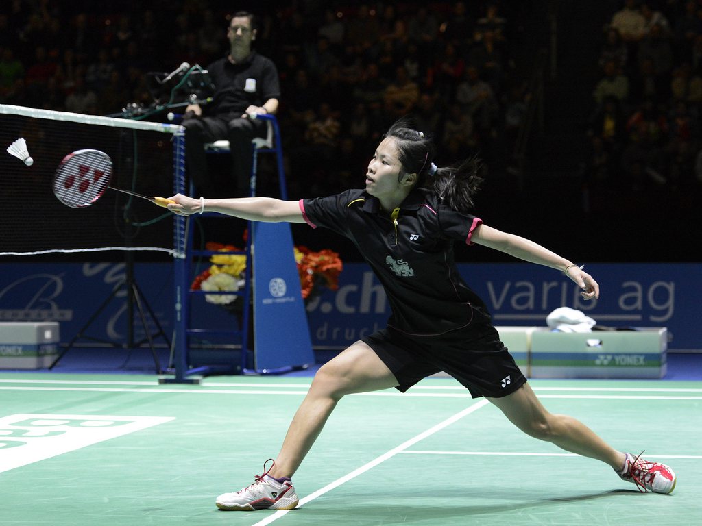 Thailand's Ratchanok Intanon returns a shuttlecock to China's Shixian Wang during their women's singles final match at the Badminton Swiss Open tournament in the St. Jakobshalle in Basel, Switzerland, on Sunday, March 17, 2013. (KEYSTONE/Georgios Kefalas)
