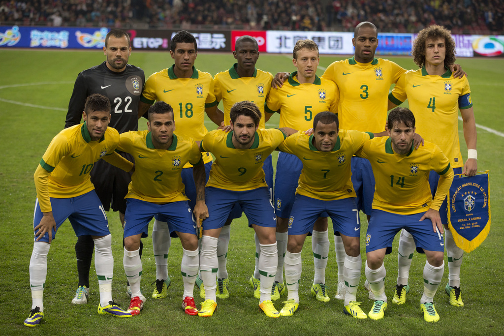 FILE - In this Oct. 15, 2013 file photo, Brazil soccer team poses prior to the start their international friendly soccer match against Zambia at the Bird's Nest national stadium in Beijing, China. Background from left: Diego Cavalier, Paulinho, Ramires,