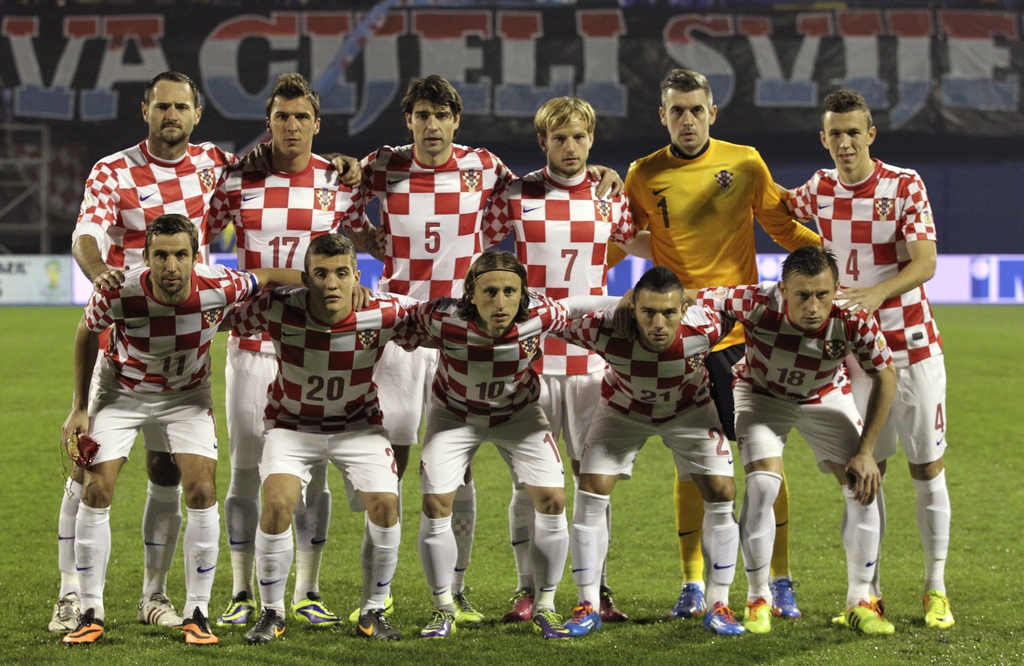 FILE - In this Nov. 19, 2013 file photo, Croatia soccer team poses prior to the start the World Cup qualifying soccer match between Croatia and Iceland in Zagreb, Croatia. Background from left: Josip Simunic, Mario Mandzukic, Vedran Corluka, Ivan Rakitic,