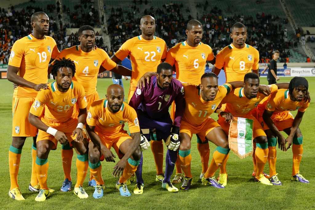 FILE - In this Nov. 16, 2013 file photo, Ivory Coast soccer team poses prior to the World Cup 2014 qualifying soccer match between Ivory Coast and Senegal at Mohammed V stadium in Casablanca, Morocco. Background from left: Yaya Toure, Toure Kolo Abib, Sou