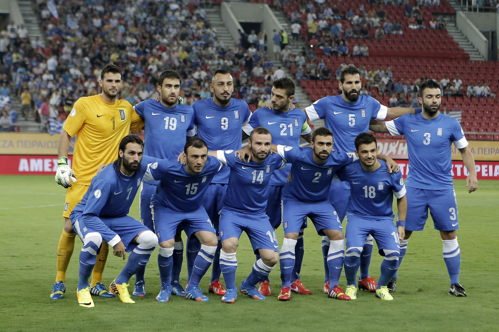 FILE - In this Sept. 10, 2013 file photo, Greece national soccer team poses prior to the start of a World Cup Group G qualifying soccer match between Greece and Latvia at the Karaiskaki stadium in Piraeus port, near Athens. Foreground from left: Giorgos S