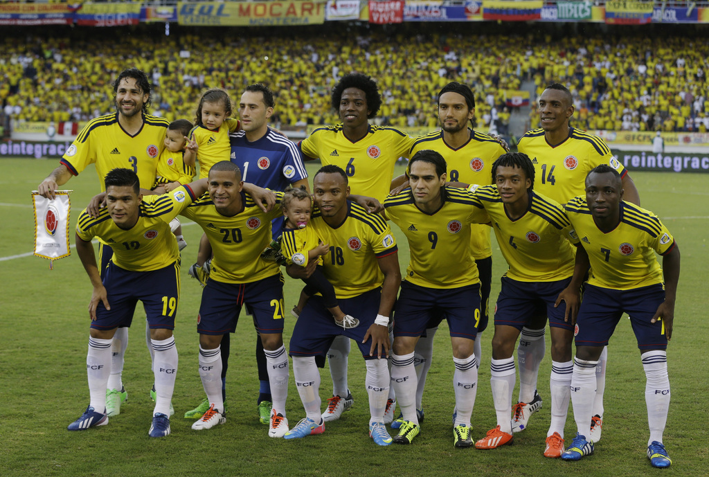 FILE - In this June 11, 2013 file photo, Colombia soccer national team pose prior to a 2014 World Cup qualifying match against Peru in Barranquilla, Colombia. Background from left: Mario Yepes, David Ospina, Carlos Sanchez, Abel Aguilar and Luis Perea. Fo