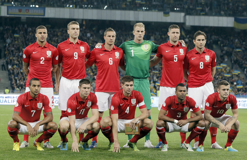 FILE - In this Sept. 10, 2013 file photo, England national soccer team poses prior to the World Cup qualifier group H soccer match between Ukraine and England at the Olympiyskiy national stadium in Kiev, Ukraine. Background from left: Kyle Walker, Rickie