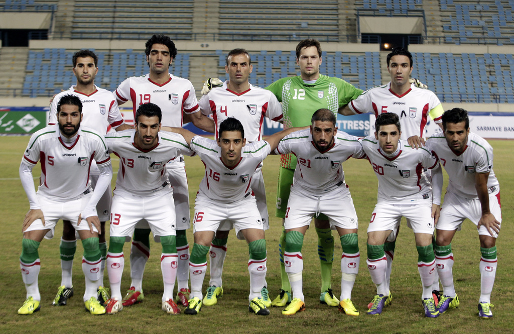 FILE - In this Nov. 19, 2013 file photo, Iran national team poses prior to the start the AFC Asian Cup 2015 qualifying soccer match between Lebanon and Iran in Beirut, Lebanon. Foreground from left: Amirhossein Sadeghi, Hossein Mahini, Reza Ghoochannejhad