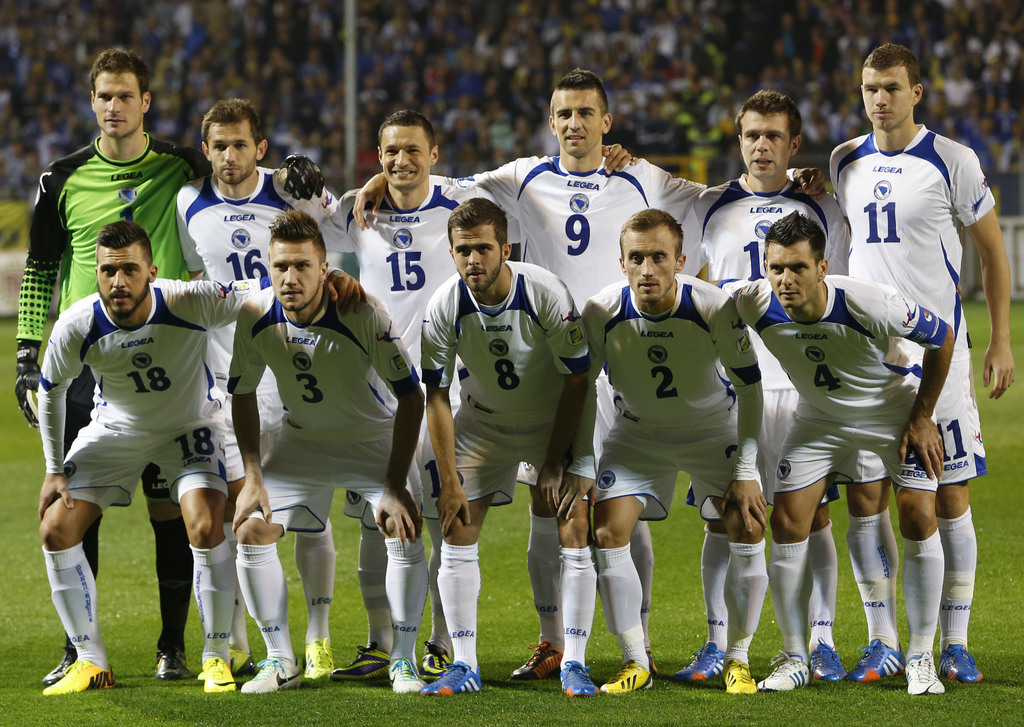 FILE- In this Oct. 11, 2013 file photo, Bosnia soccer team poses prior to the start the World Cup Group G qualifying soccer match between Bosnia and Liechtenstein at Stadium Bilino Polje in Zenica, Bosnia. Background from left: Asmir Begovic, Senad Lulic,