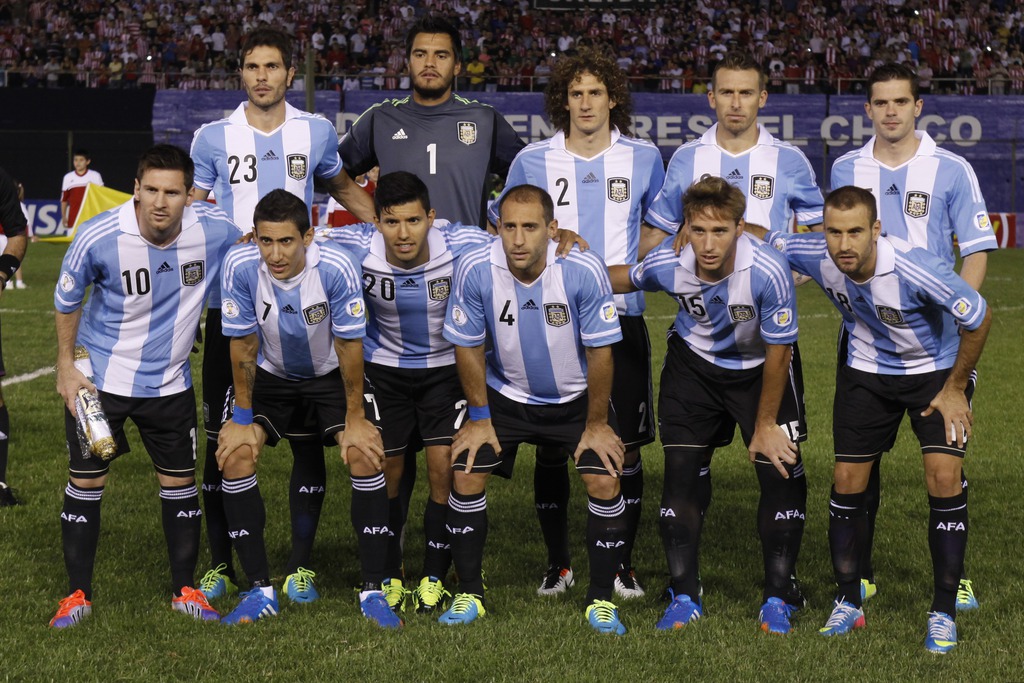 In this Sept. 10, 2013 photo, Argentina soccer team poses prior to the start the World Cup qualifying soccer match between Argentina and Paraguay in Asuncion, Paraguay. Background from left: Jose Basanta, Sergio Romero, Fabricio Coloccini, Hugo Campagnaro