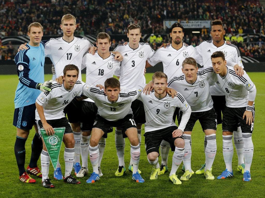 FILE - In this Oct 11, 2013 file photo, Germany soccer team poses prior to the start the World Cup Group C qualifying soccer match between Germany and Ireland in Cologne, Germany. Background from left: Manuel Neuer, Per Mertesacker, Toni Kroos. Marcell Ja
