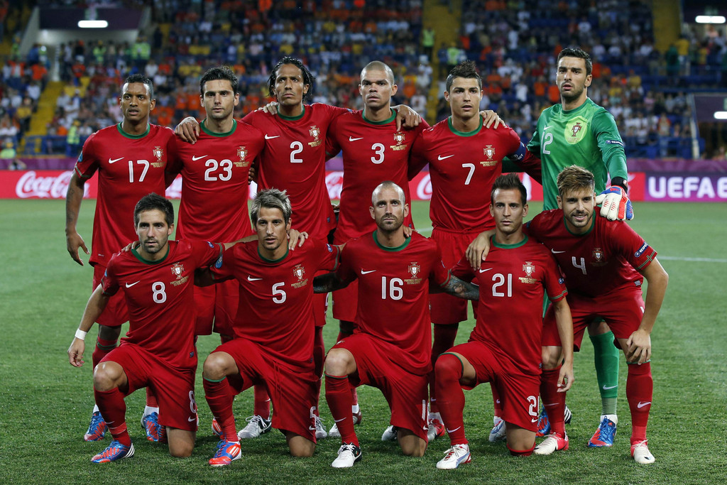 FILE - In this June 13, 2012 file photo, Portugal soccer team poses prior to the start the Euro 2012 soccer championship Group B match between Portugal and the Netherlands in Kharkiv, Ukraine. Background from left: Nani, Helder Postiga, Bruno Alves, Pepe