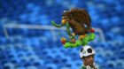 epa04253794 A supporter of Mexico waits for the FIFA World Cup 2014 group A preliminary round match between Mexico and Camero