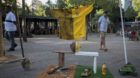 An exhibition of a Brazil national soccer jersey shows the two economic extremes of the sport, during a protest against the p