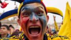 epa04267655 Colombian national soccer team suppoerters cheer at Bolivar Square to watch the broadcasting of the FIFA World Cu