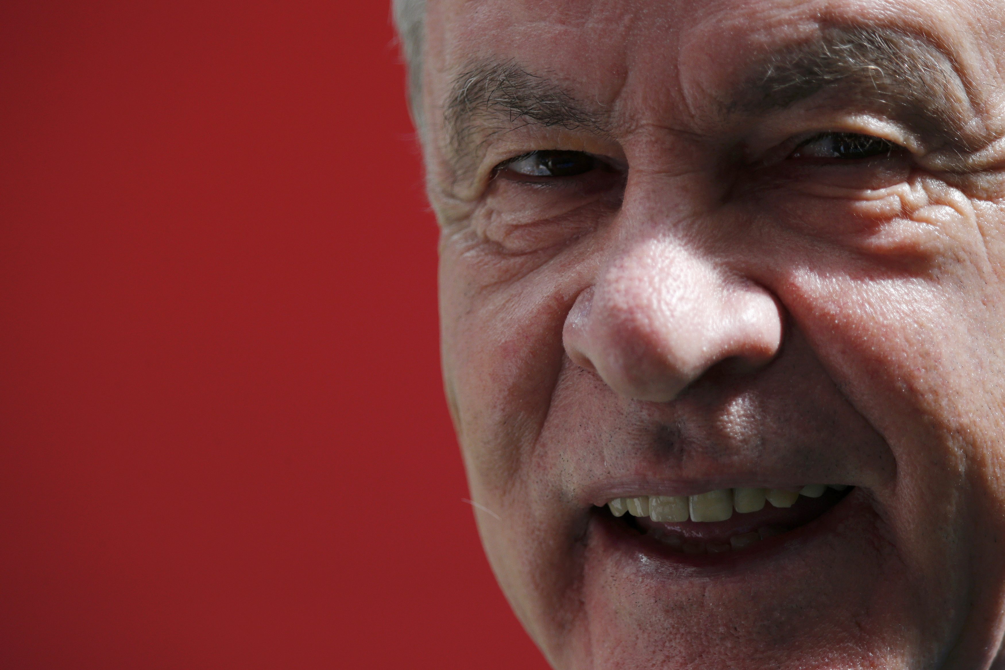 Switzerland's coach Ottmar Hitzfeld smiles during a soccer training session at the national stadium in Brasilia ahead of their 2014 World Cup Group E soccer match against Ecuador June 14, 2014. REUTERS/Ueslei Marcelino (BRAZIL - Tags: SPORT SOCCER WOR