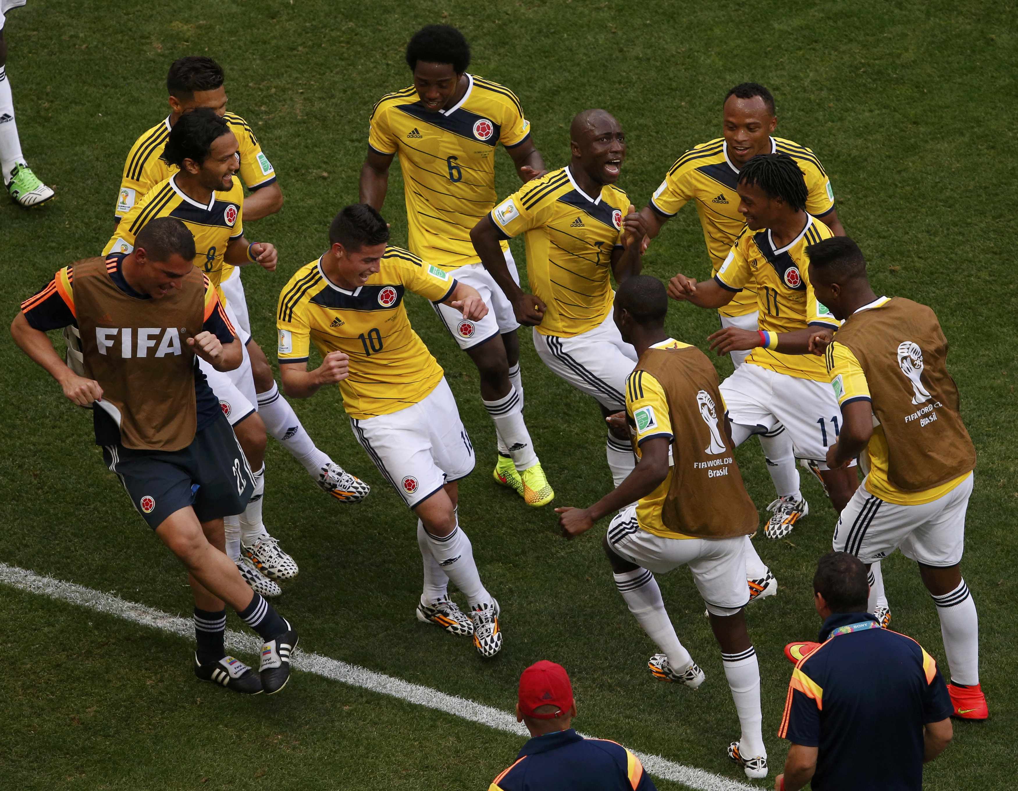 Colombia's James Rodriguez (4th L) celebrates by dancing with his teammates after scoring past Ivory Coast during their 2014 World Cup Group C soccer match at the Brasilia national stadium in Brasilia June 19, 2014. REUTERS/David Gra