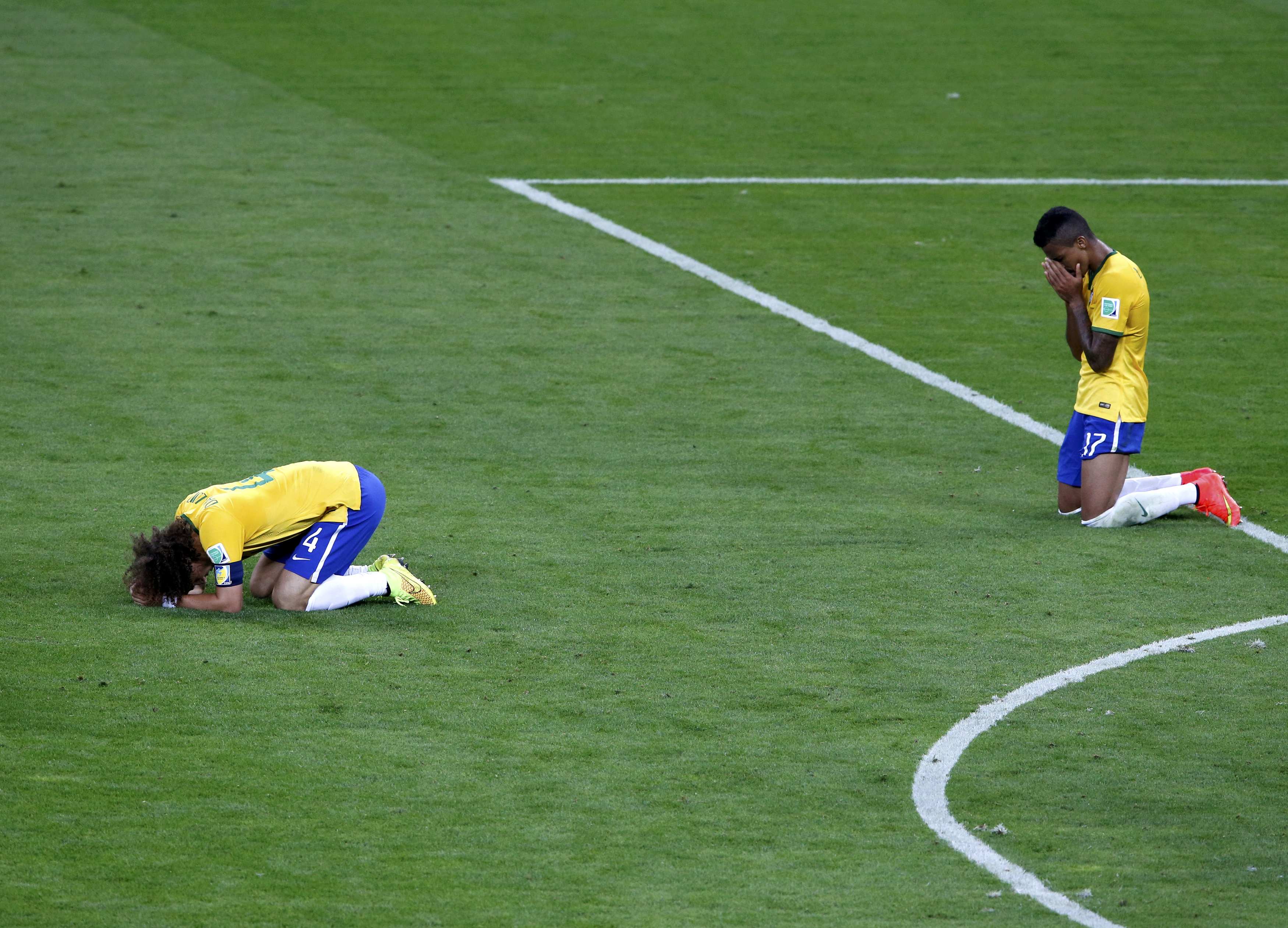 Brazil's David Luiz (L) and Luiz Gustavo react after losing their 2014 World Cup semi-finals against Germany at the Mineirao stadium in Belo Horizonte July 8, 2014. REUTERS/David Gray (BRAZIL  - Tags: SOCCER SPORT WORLD CUP)          TOPCUP