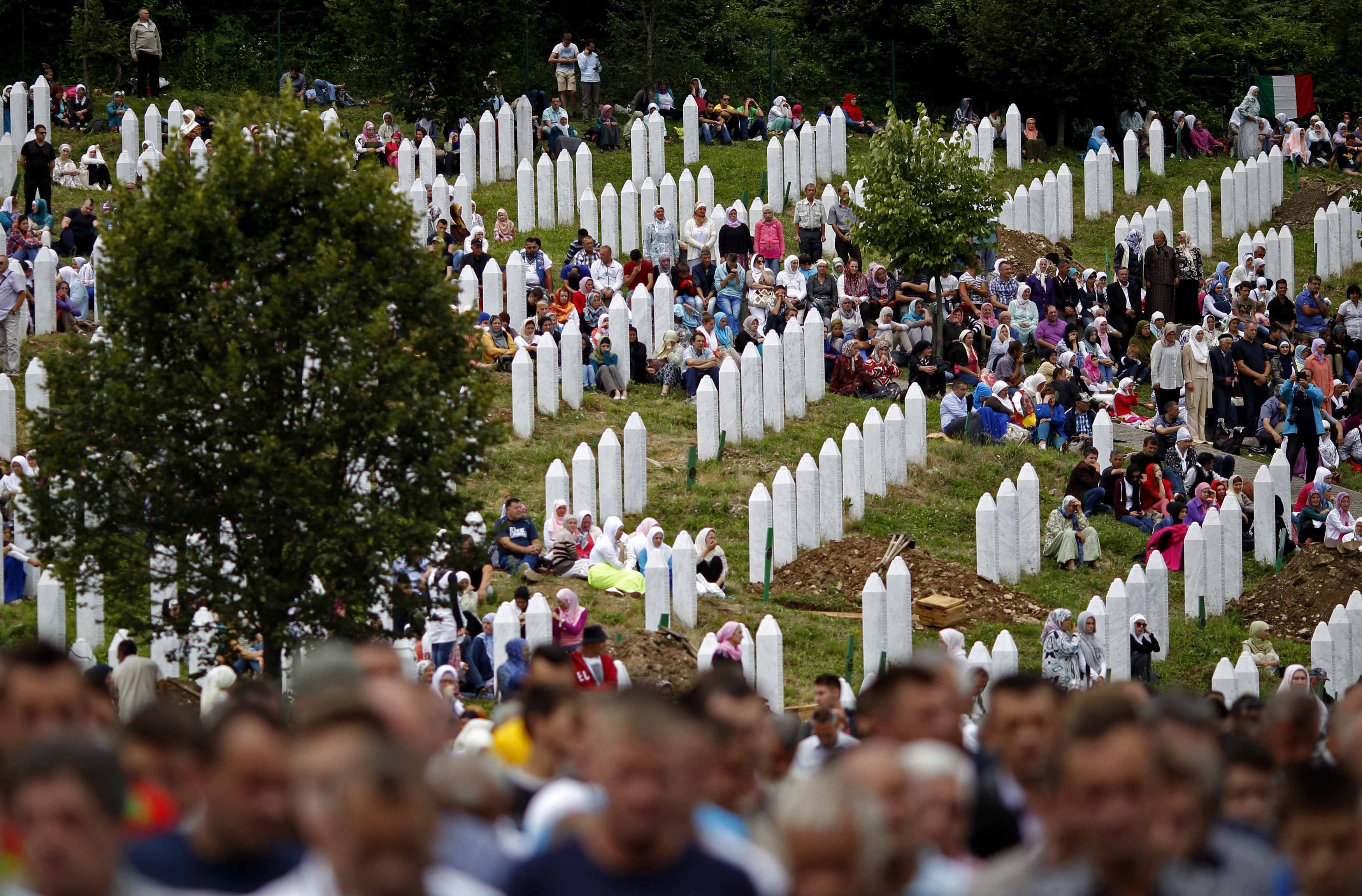Bosnian Muslims attend the mass funeral of 175 newly identified victims from the 1995 Srebrenica massacre, in Potocari Memorial Center, near Srebrenica, July 11, 2014. Family members, foreign dignitaries and guests are expected to attend a ceremony in Sre