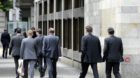 Bankers walk in front of UBS head office at the Paradeplatz in Zurich, Switzerland, pictured on Thursday, 14 july 2011. (KEYS