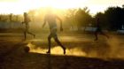 epa04315212 Brazilian boys play soccer on a dusty playground in the Vila Estrutural shanty town, 15km from Brasilia, Brazil,