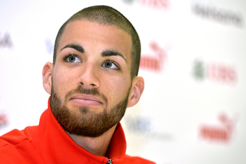 Swiss hurdles runner Kariem Hussein speaks at a press conference from Swiss Atheltics in Regensdorf, Switzerland, Thursday, August 14, 2014. (KEYSTONE/Walter Bieri)