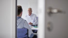 A collaborator of the government employment agency RAV in Suhr in the canton of Aargau, Switzerland, talks to a young unemplo