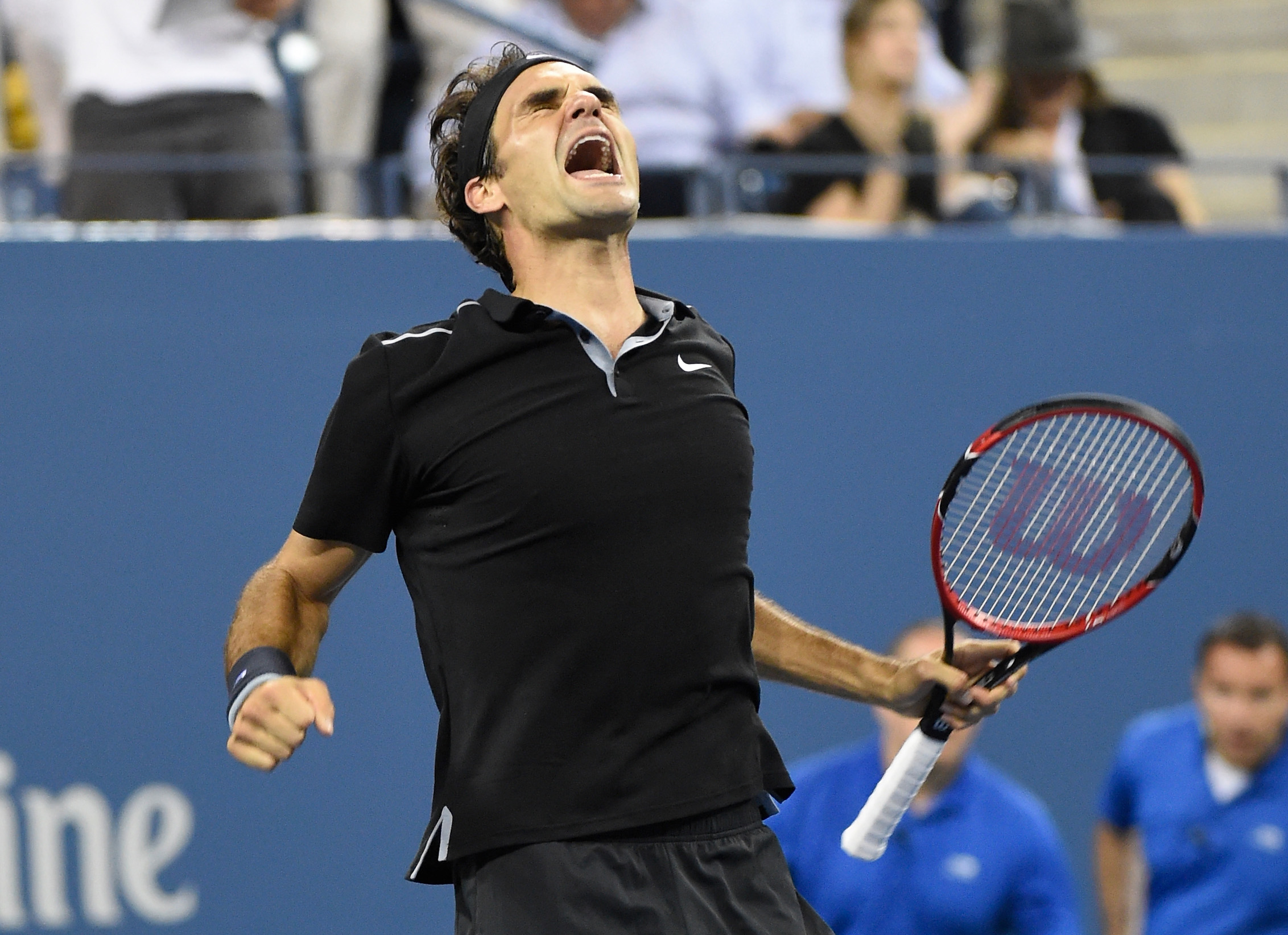 Sep 4, 2014; New York, NY, USA; Roger Federer (SUI) celebrates after recording match point against Gael Monfils (FRA) on day eleven of the 2014 U.S. Open tennis tournament at USTA Billie Jean King National Tennis Center. Mandatory Credit: Robert Deutsch-U