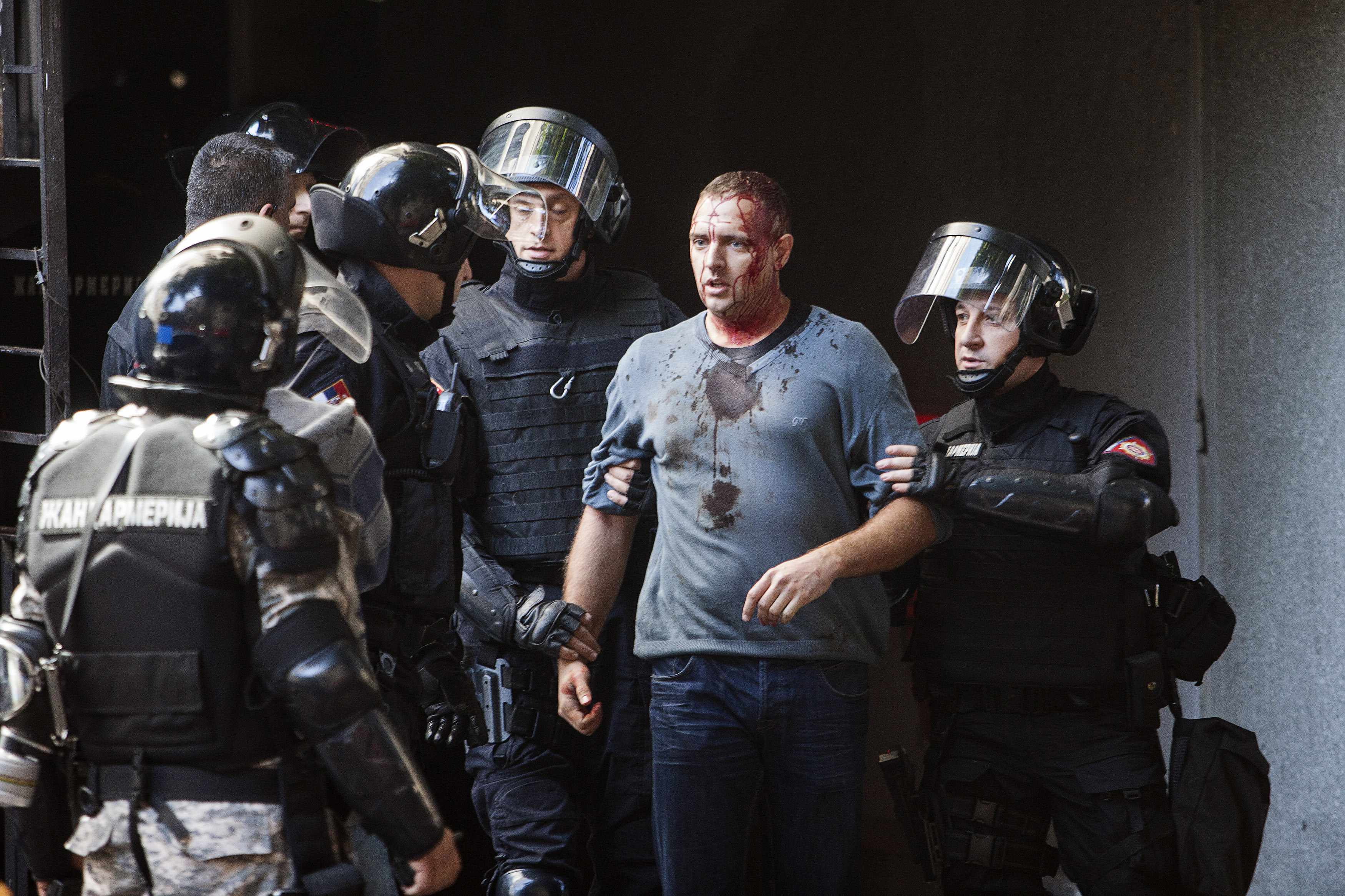 Riot police detain an anti gay activist during a Pride march in Belgrade, September 28, 2014. Gay rights activists in Serbia held their first Pride march in four years on Sunday, walking through Belgrade streets emptied of traffic and pedestrians by a mas