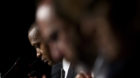 Google's Senior Vice President of Corporate Development and Chief Legal Officer, David Carl Drummond, left, reads during a me