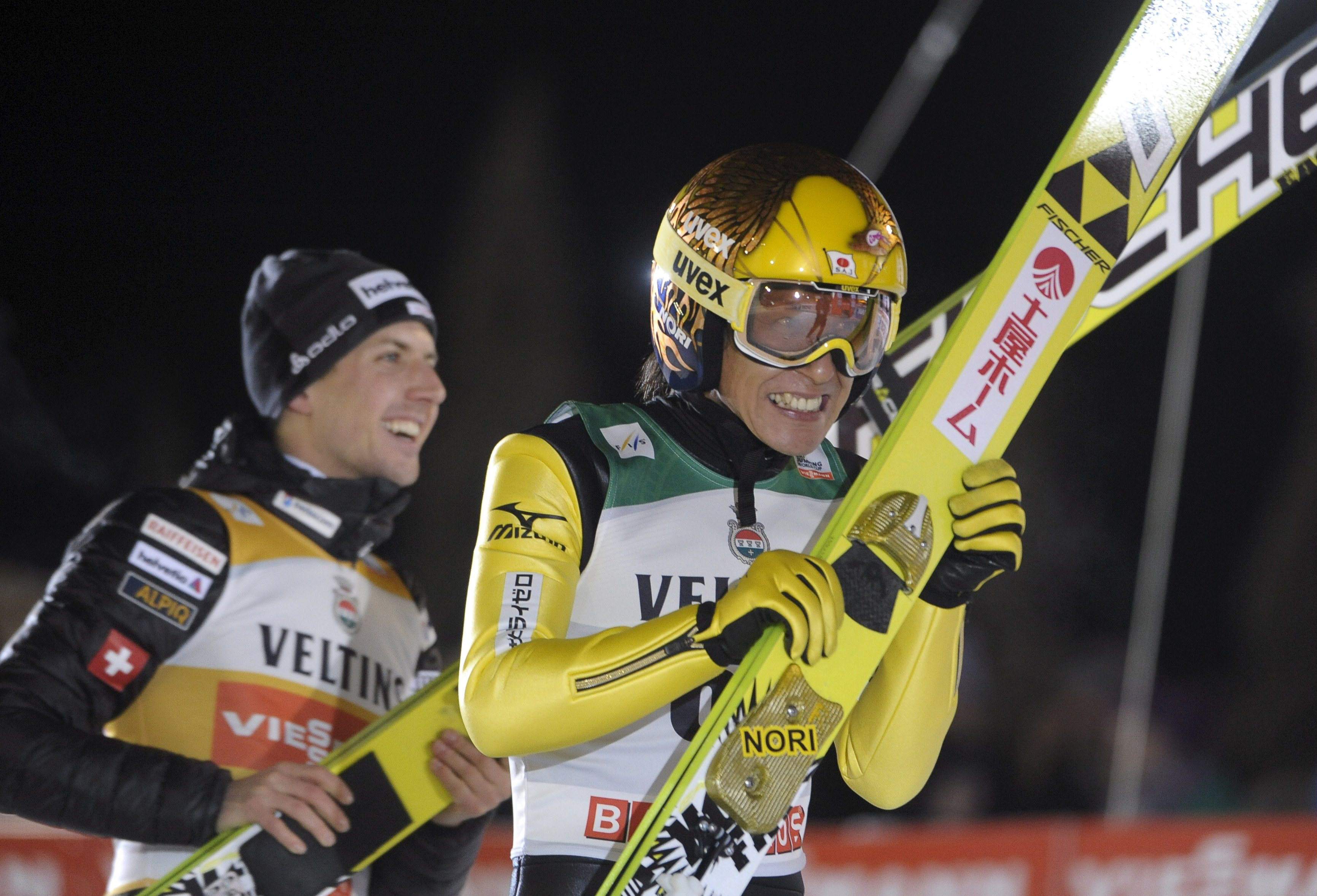 Japan's Noriaki Kasai (R) and Switzerland's Simon Ammann celebrate their shared victory in the men's ski jumping HS 142 Large Hill Individual event at the FIS World Cup Ruka Nordic Opening 2014 in Kuusamo, November 29, 2014. REUTERS/Heikki Saukkomaa/Lehtikuva (FINLAND - Tags: SPORT SKIING) ATTENTION EDITORS - THIS IMAGE HAS BEEN SUPPLIED BY A THIRD PARTY. IT IS DISTRIBUTED, EXACTLY AS RECEIVED BY REUTERS, AS A SERVICE TO CLIENTS. NO THIRD PARTY SALES. NOT FOR USE BY REUTERS THIRD PARTY DISTRIBUTORS. FINLAND OUT. NO COMMERCIAL OR EDITORIAL SALES IN FINLAND