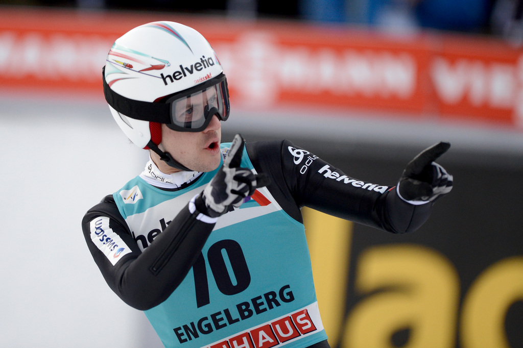 Simon Ammann from Switzerland celebrates his 2nd place at the men's FIS World Cup Ski Jumping at the Titlisschanze in Engelberg, Switzerland, Sunday, 21 December 2014. (KEYSTONE/Urs Flueeler)