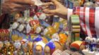 epa04530387 Matryoshkas, traditional Russian nesting dolls, depicting Russian President Vladimir Putin (C), are displayed for