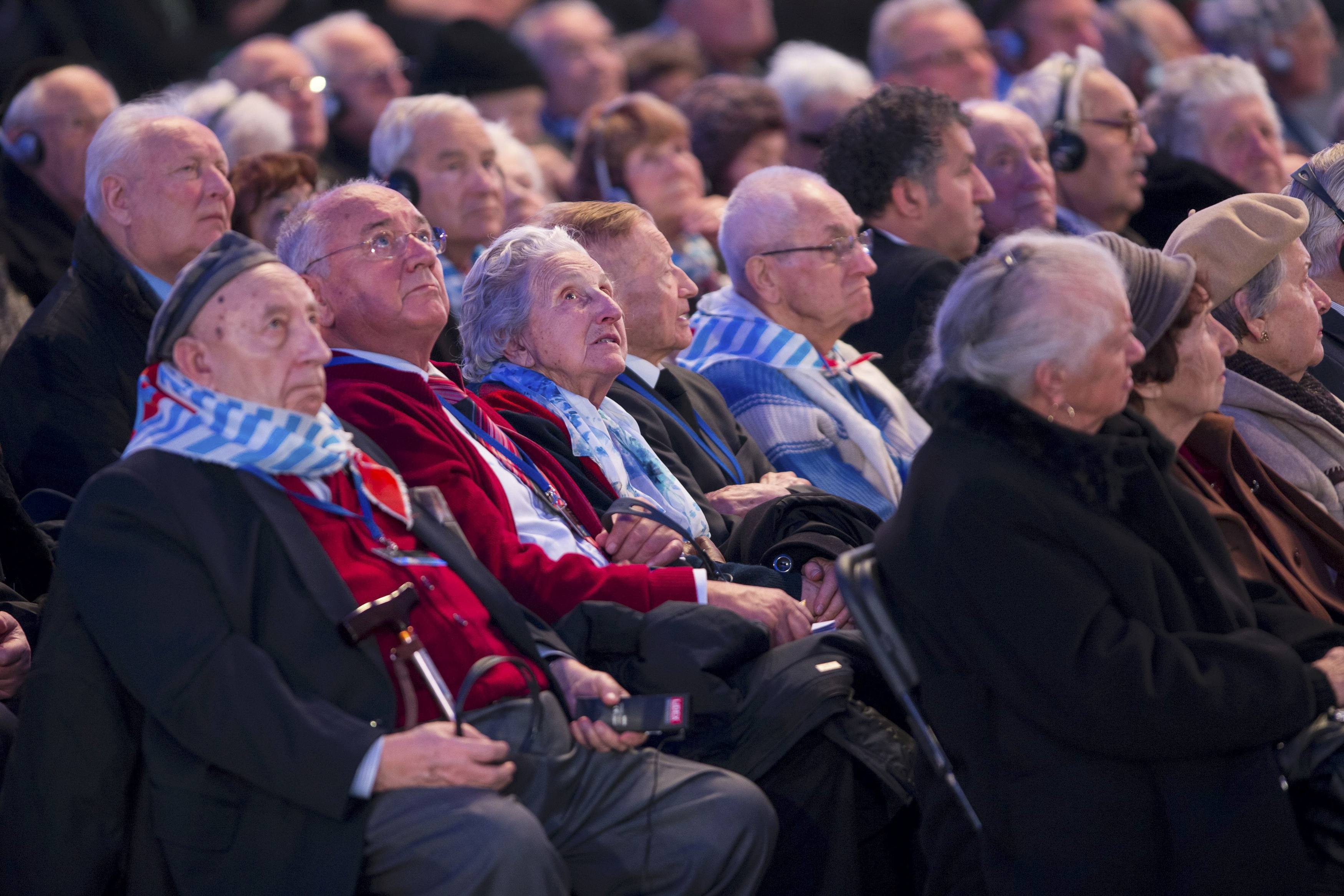 Survivors attend a ceremony on the site of the former Nazi German concentration and extermination camp Auschwitz-Birkenau near Oswiecim January 27, 2015. Ceremonies to mark the 70th anniversary of the liberation of the camp take place on January 27, with some 300 former Auschwitz prisoners taking part in the commemoration event. Nazi Germany built the Auschwitz camp in 1940 as a place of incarceration for the Poles. From 1942, it became the largest site of extermination of the Jews from Europe. In Auschwitz, Nazis killed at least 1.1 million people, mainly Jews, but also Poles, Roma, Soviet prisoners of war and prisoners of other ethnicities. On January 27, 1945 the camp was liberated by the Red Army soldiers. REUTERS/Michal Lepecki/Agencja Gazeta (POLAND - Tags: SOCIETY CONFLICT) THIS IMAGE HAS BEEN SUPPLIED BY A THIRD PARTY. IT IS DISTRIBUTED, EXACTLY AS RECEIVED BY REUTERS, AS A SERVICE TO CLIENTS. POLAND OUT. NO COMMERCIAL OR EDITORIAL SALES IN POLAND.