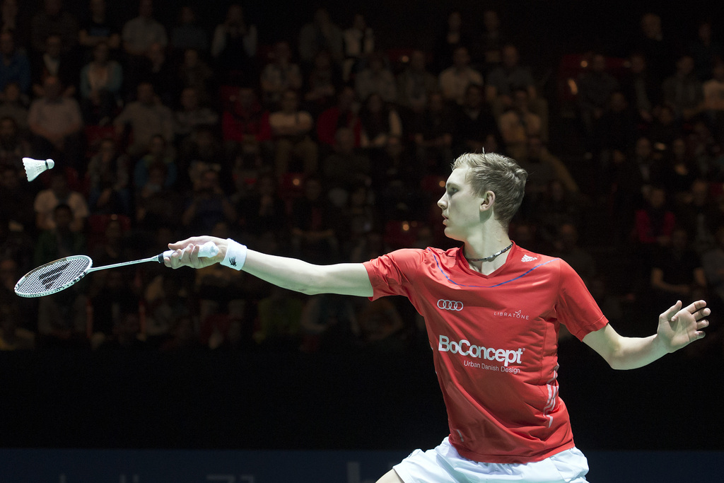 Denmark's Viktor Axelsen returns a shuttlecock to China's Houwei Tian during their men's singles final match at the Badminton Swiss Open tournament in the St. Jakobshalle in Basel, Switzerland, on Sunday, March 16, 2014. (KEYSTONE/Georgios Kefalas)