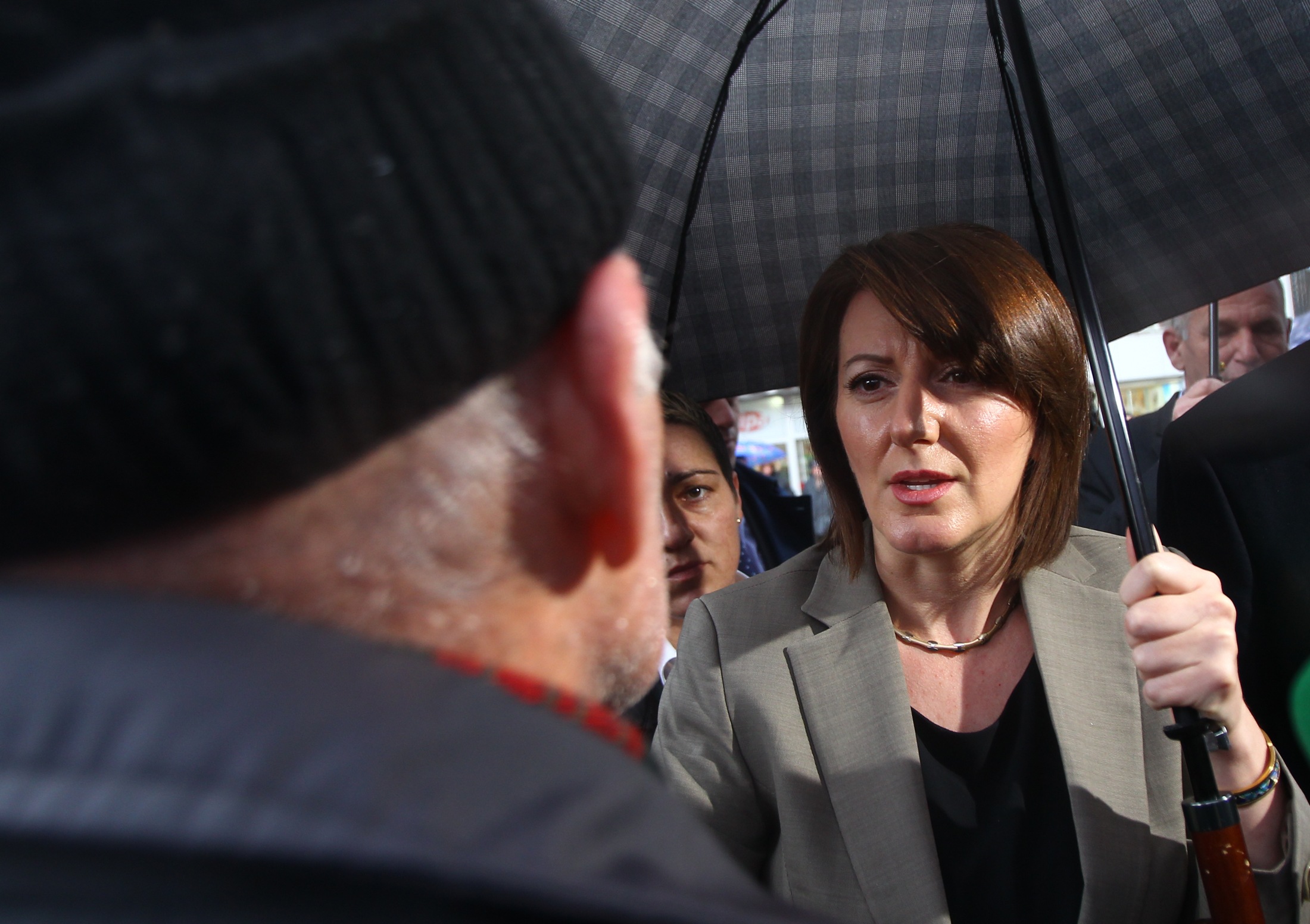 The president of Kosovo, Atifete Jahjaga speaks with people in the town of Vushtrri February 6, 2015. The European Union is experiencing a steep rise in the number of Kosovo citizens smuggling themselves into the affluent bloc, with 10,000 filing for asylum in Hungary in just one month this year compared to 6,000 for the whole of 2013. It follows a relaxation of travel rules allowing Kosovars to reach EU borders via Serbia and has coincided with political turmoil and street unrest in Kosovo fuelled by poverty, high unemployment and economically debilitating corruption. REUTERS/Hazir Reka (KOSOVO - Tags: - Tags: POLITICS)