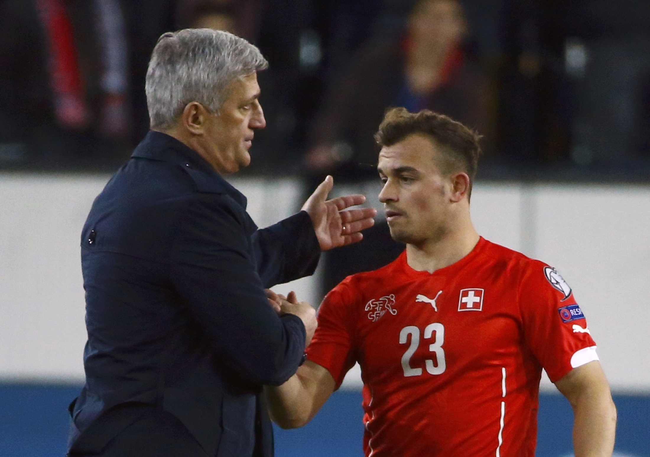 Coach Vladimir Petkovic and Xherdan Shaqiri of Switzerland celebrate after their Euro 2016 Group E qualifying soccer match against Estonia at Swisspore arena in Luzern March 27, 2015. REUTERS/Ruben Sprich