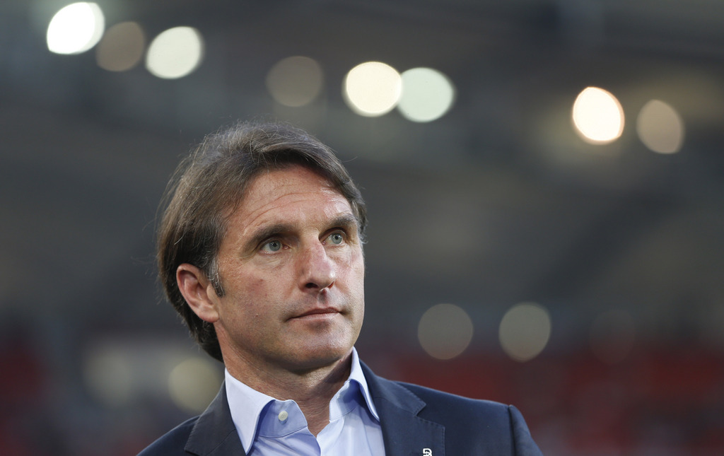 FILE - In this April 17, 2013 file photo then Stuttgart head coach Bruno Labbadia awaits an interview prior to the German Soccer Cup (DFB Pokal) semi final match between VfB Stuttgart and FC Freiburg, in Stuttgart, southern Germany. Bottom side Hamburger SV has hired Bruno Labbadia as its new coach in an effort to head off its first-ever relegation from the Bundesliga, the club said Wednesday, April 15, 2015. (AP Photo/Matthias Schrader, file)