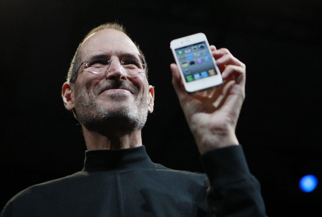 FILE - In this June 7, 2010, file photo, Apple CEO Steve Jobs holds a new iPhone at the Apple Worldwide Developers Conference in San Francisco. Two tech titans are squaring off in federal court Monday in a closely watched trial over control of the worldwide smart phone and computer tablet markets. Apple Inc. filed a lawsuit against Samsung Electronics Co. last year alleging the world�s largest technology company�s smart phones and computer tablets are illegal knockoffs. Samsung countered that it�s Apple that is doing the stealing and, besides, some of the technology at issue such as the rounded rectangular designs of smart phones have been industry standards for years. (AP Photo/Paul Sakuma, File)
