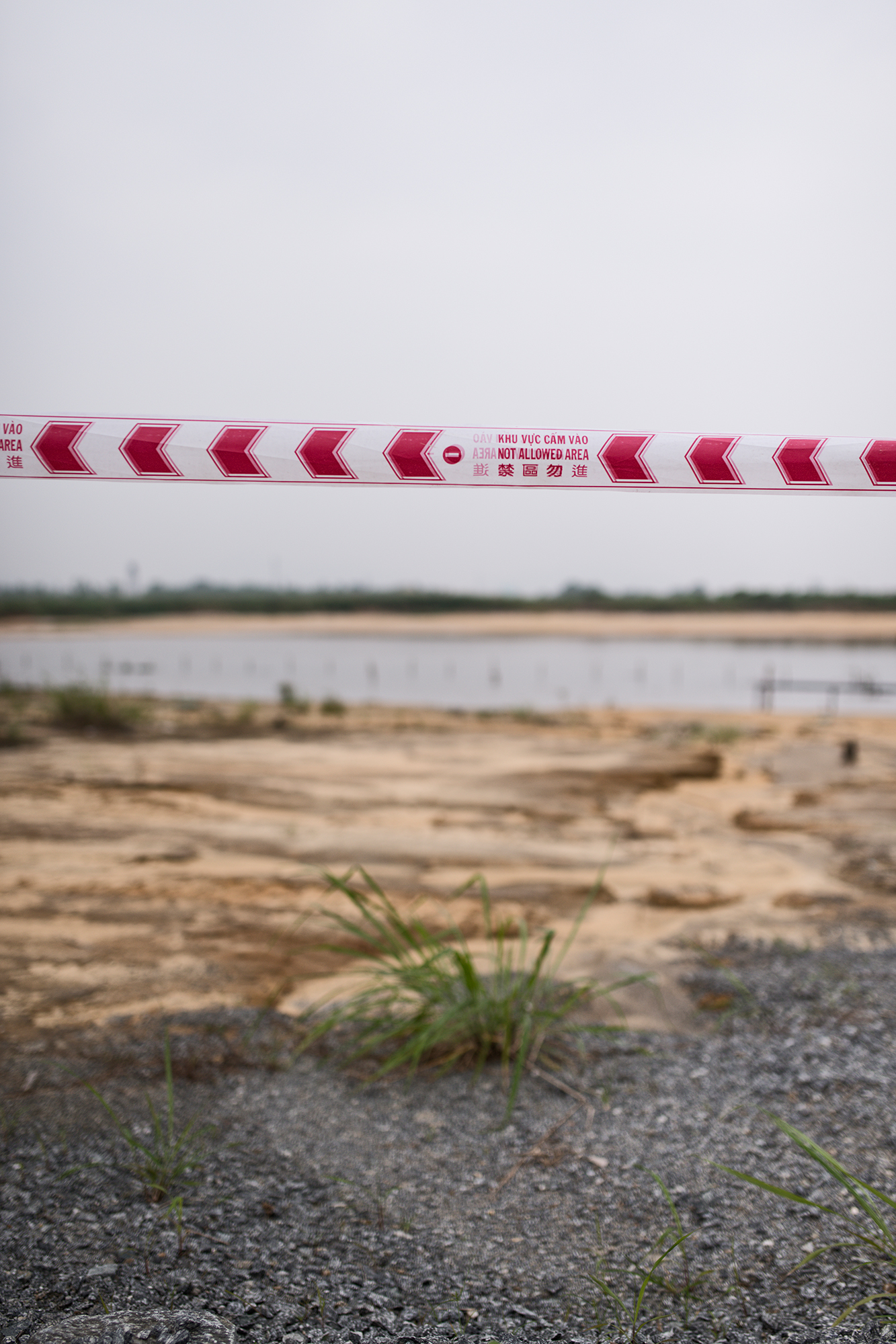 Da Nang. 09.12.2013 - Agent Orange cleanup at the airport. The U.S. Agency for International Development (USAID) has awarded contracts to two U.S. companies to work on the project along with Vietnam defense ministry officials. Area with contanimated ground. Photo by ©Roland Schmid