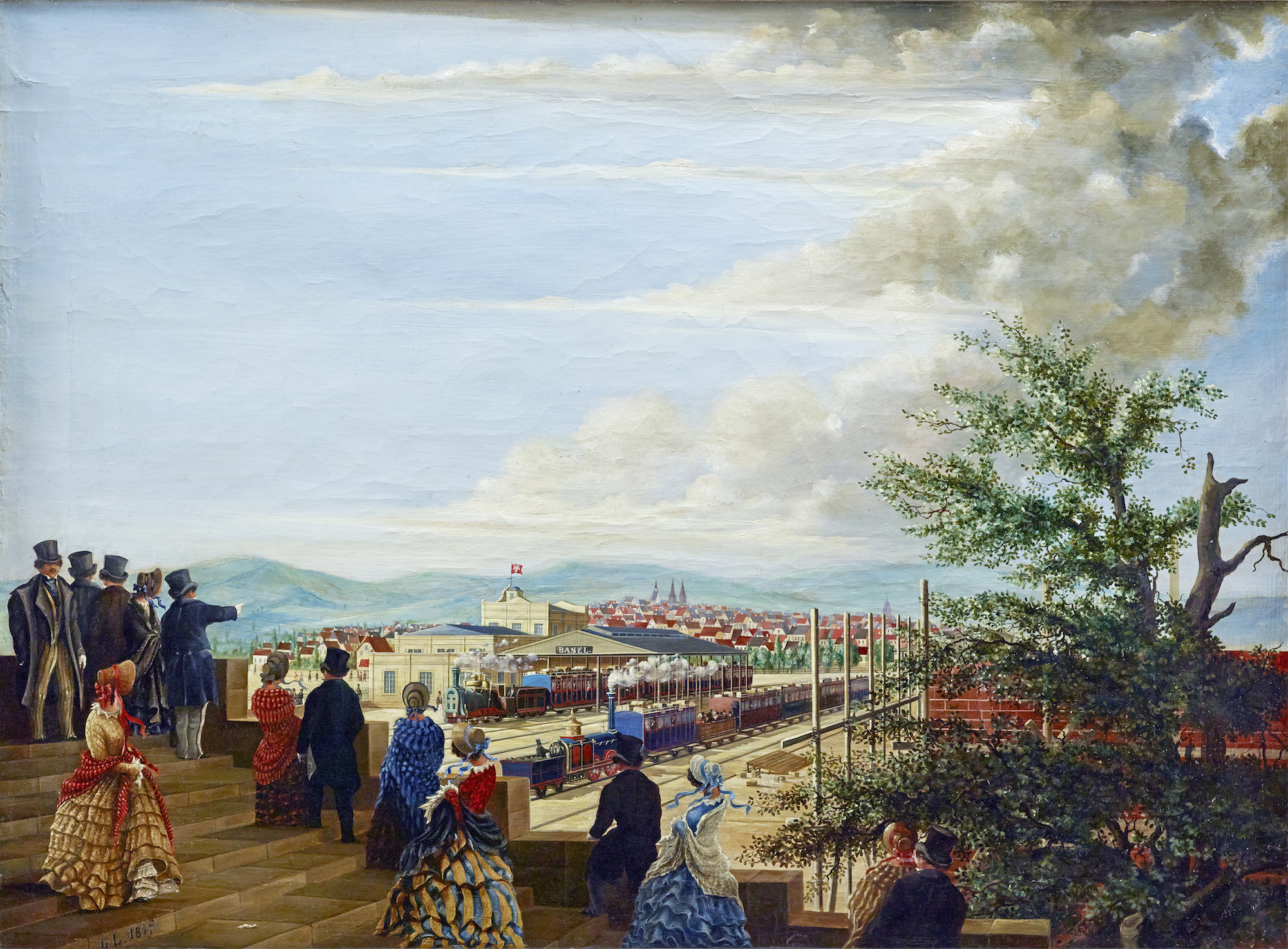 Ansicht des ersten französischen Bahnhofs in Basel, bezeichnet «G.L. 1847». Blick vom nordwestlich gelegenen, von Melchior berri entworfenen Eisenbahntor in der Stadtmauer auf die Bahnhofsanlage. In der Mode des Spädbiedermeier gkleidete Basler und Baslerinnen verfolgen den Betrieb des neuen Verkehrsmittels.
