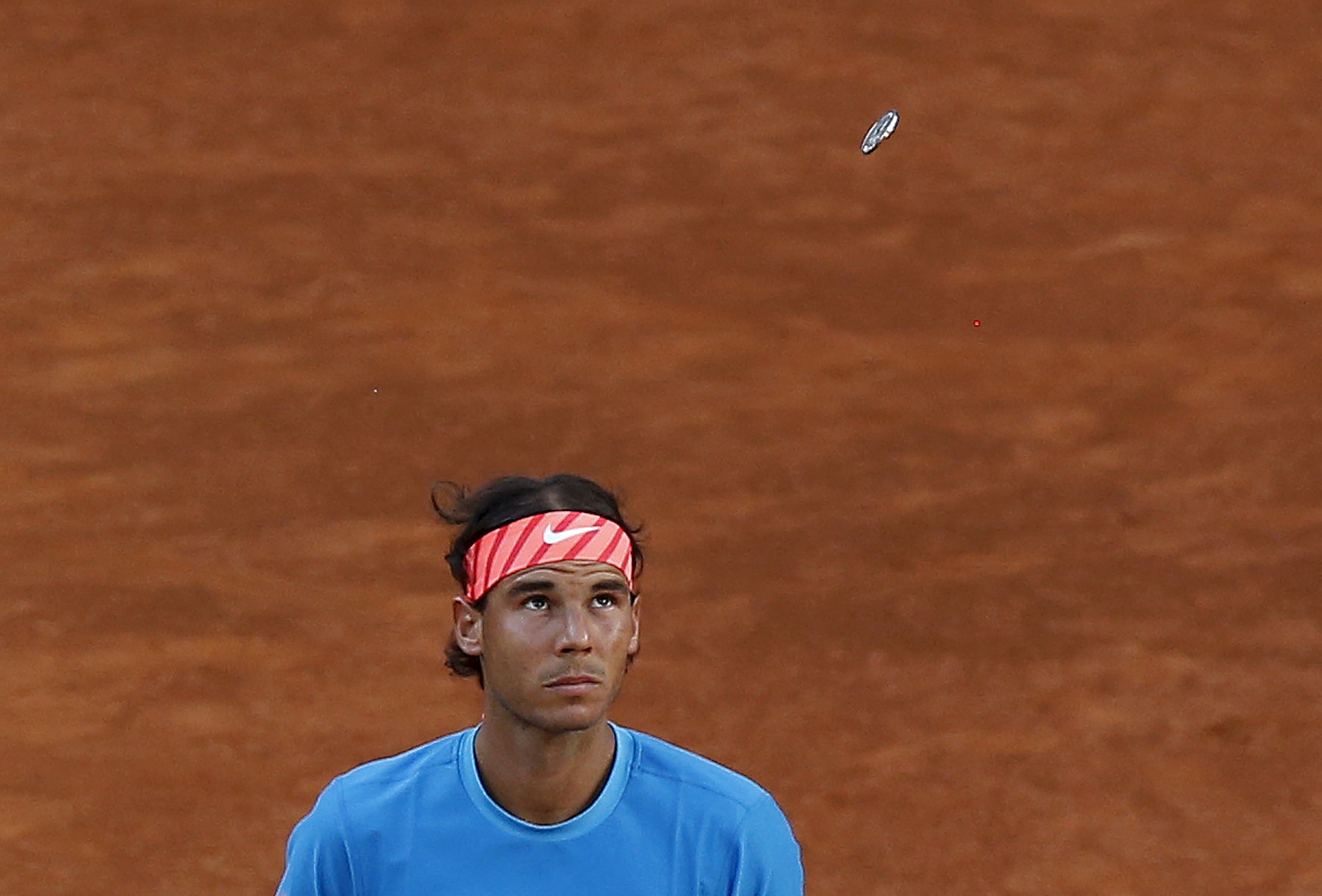Spain's Rafael Nadal looks up during the coin toss before his final match against Britain's Andy Murray at the Madrid Open tennis tournament in Madrid, Spain, May 10, 2015. REUTERS/Andrea Comas
