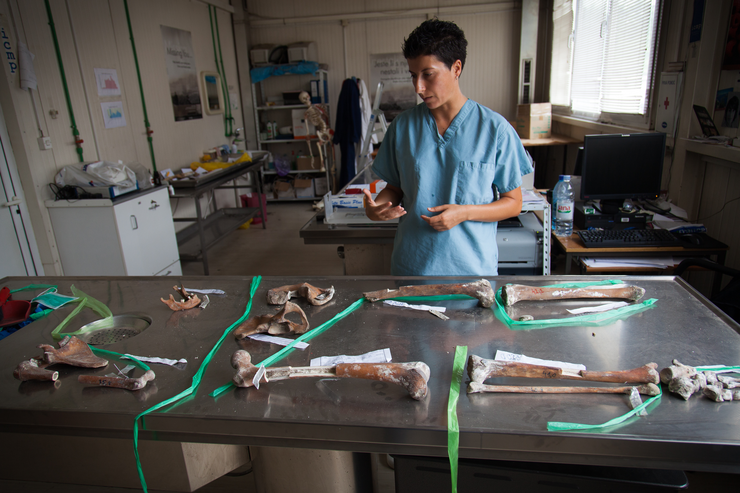 Dragana Vučetić, Senior Forensic Anthropologist at the International Comitee for Missing Persons (ICMP), with human remains found in a secondary mass grave.