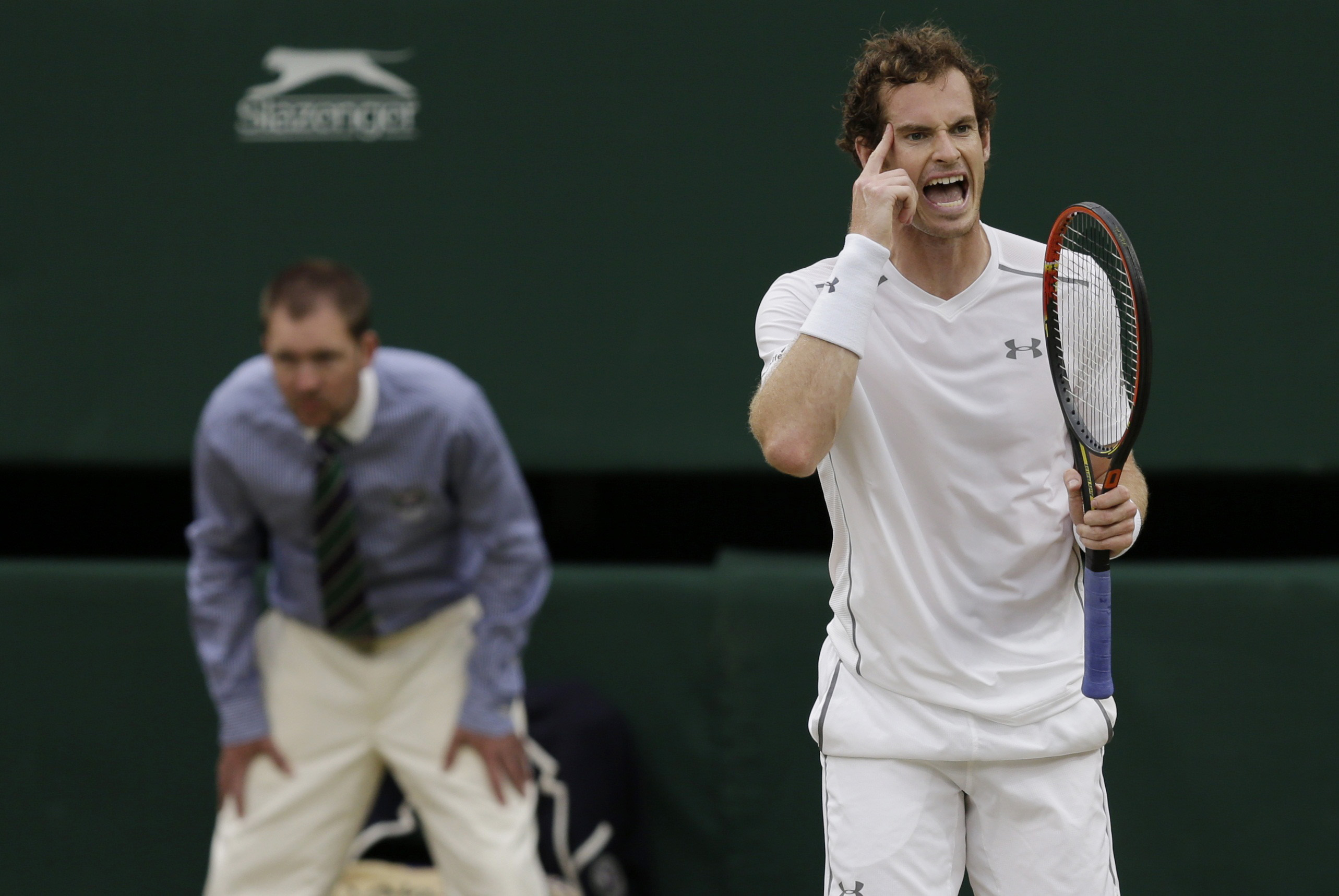 Andy Murray of Britain reacts during his match against Vasek Pospisil of Canada at the Wimbledon Tennis Championships in London, July 8, 2015. REUTERS/Henry Browne